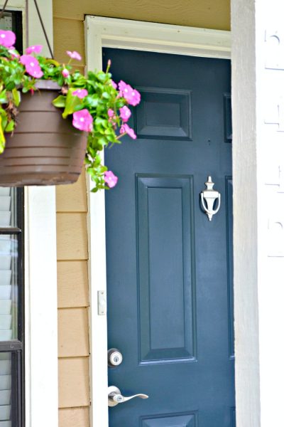 front exterior blue door and hanging basket