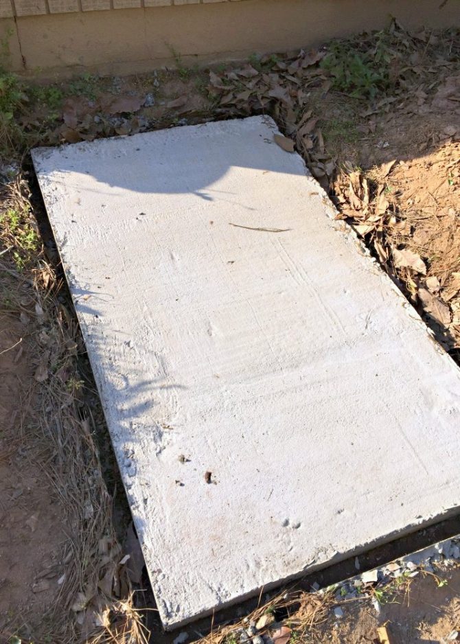 Laying a DIY Concrete Slab for Hiding City Trash Cans