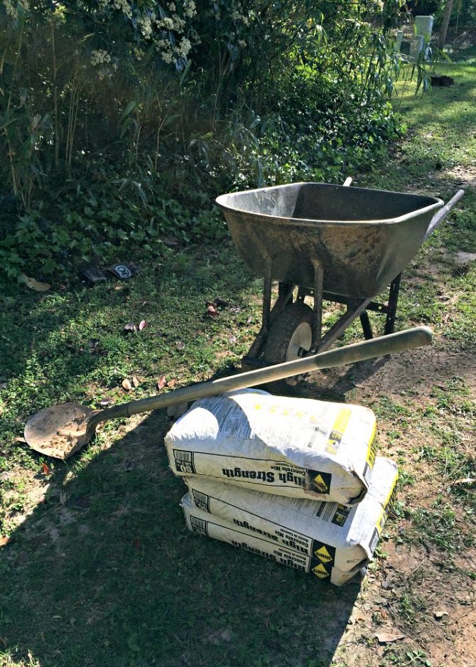 Laying a DIY Concrete Slab for Hiding City Trash Cans