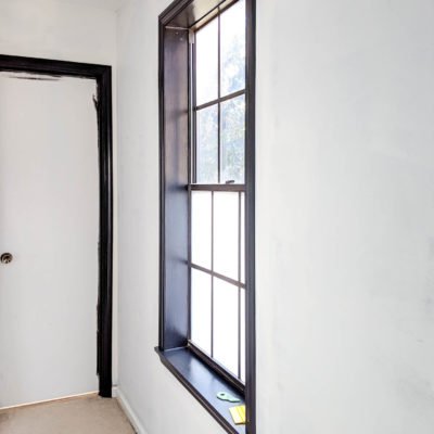 master bedroom hallway window with new window film - tricorn black paint