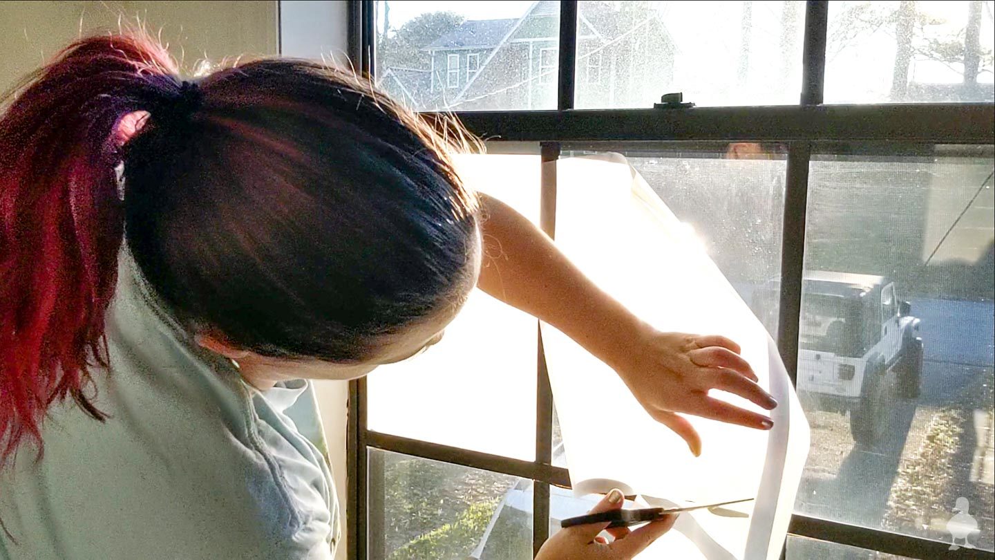roll out window film and cut to approximate size