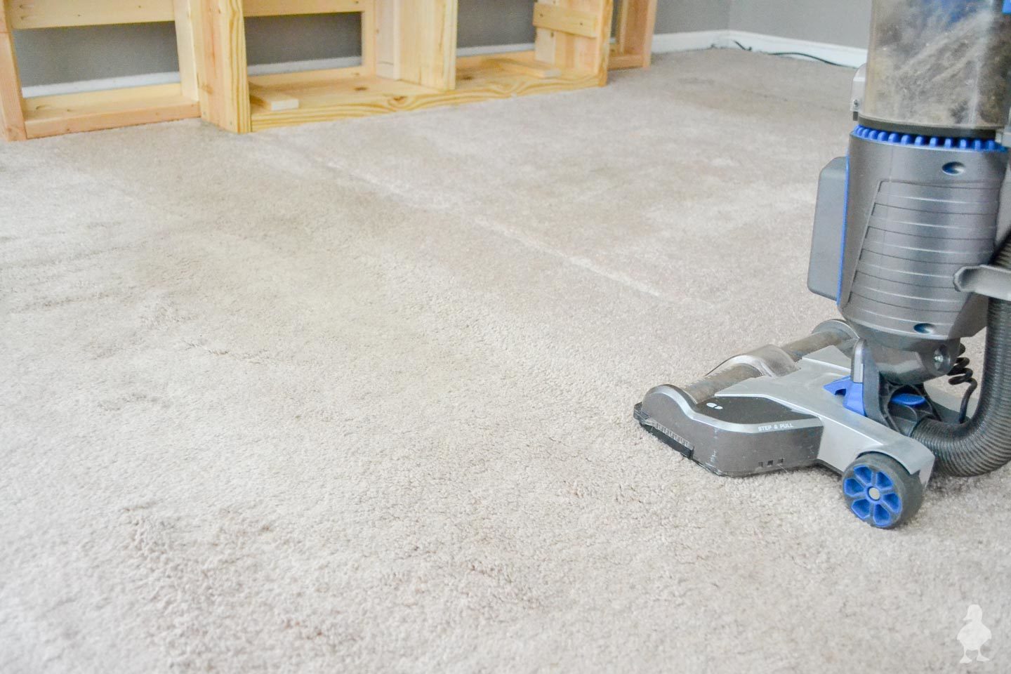 vacuuum carpet before laying down new rugs