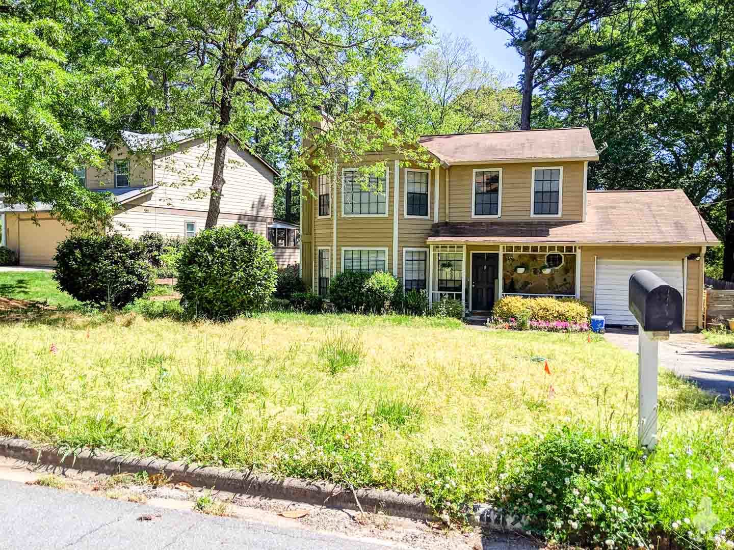front lawn with disjointed landscaping plan