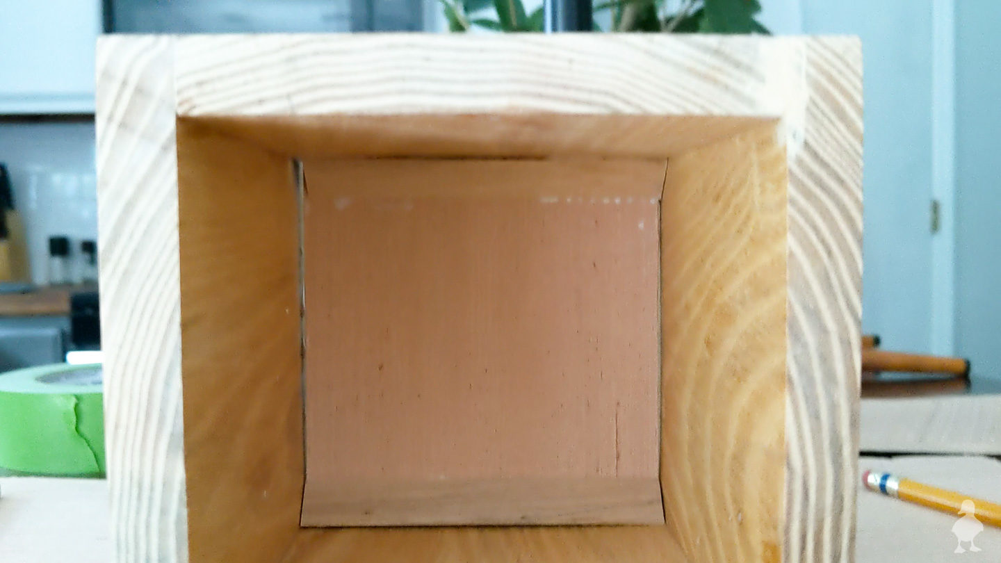 bottom of vase to hold greenery above baking soda drawer