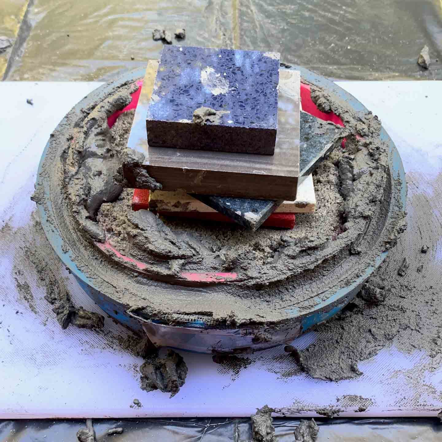 molds weighed down for diy cement candleholder