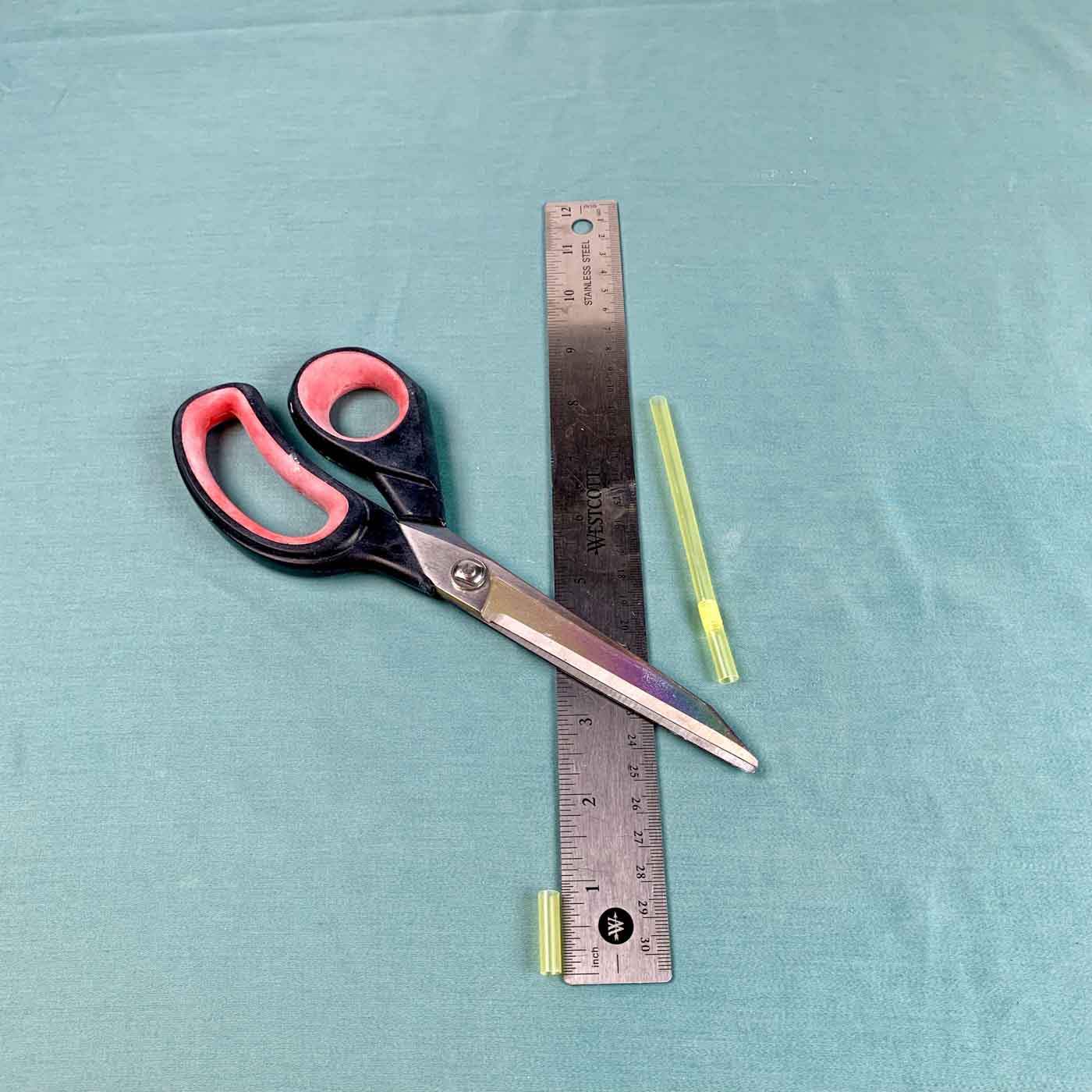 scissors cut straw, ruler white cement river planter