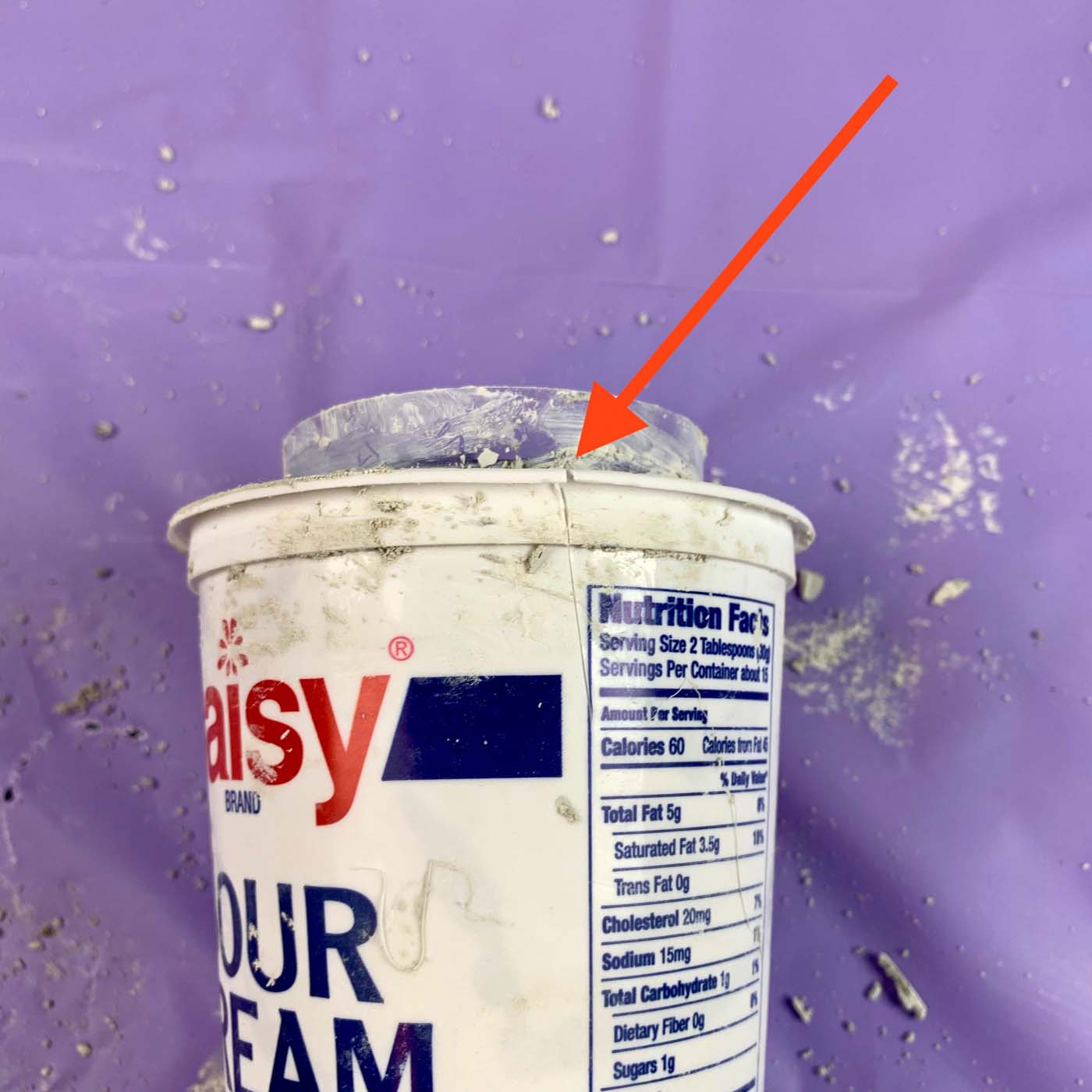 slit in side of cement planter container