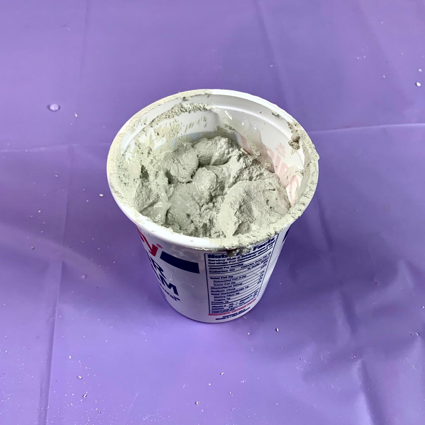 white cement planter filled with cement