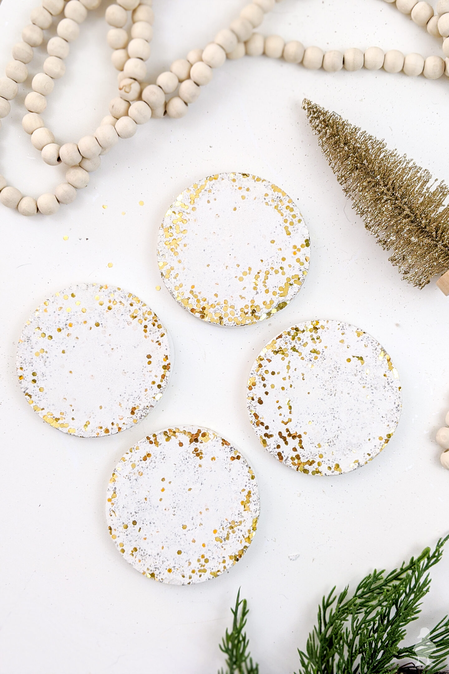 So neat! Glitter and confetti white concrete coasters can be made in an afternoon and make excellent gifts! Can also be made with kids as a Christmas craft with lots of personalized options! Get the full video and tutorial here #whiteconcrete #diycoasters #glitter #confetti #newyears #partydecoration #hostessgift #neighborgift
