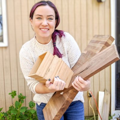 ten years of Ugly Duckling House - Sarah holding scrap wood