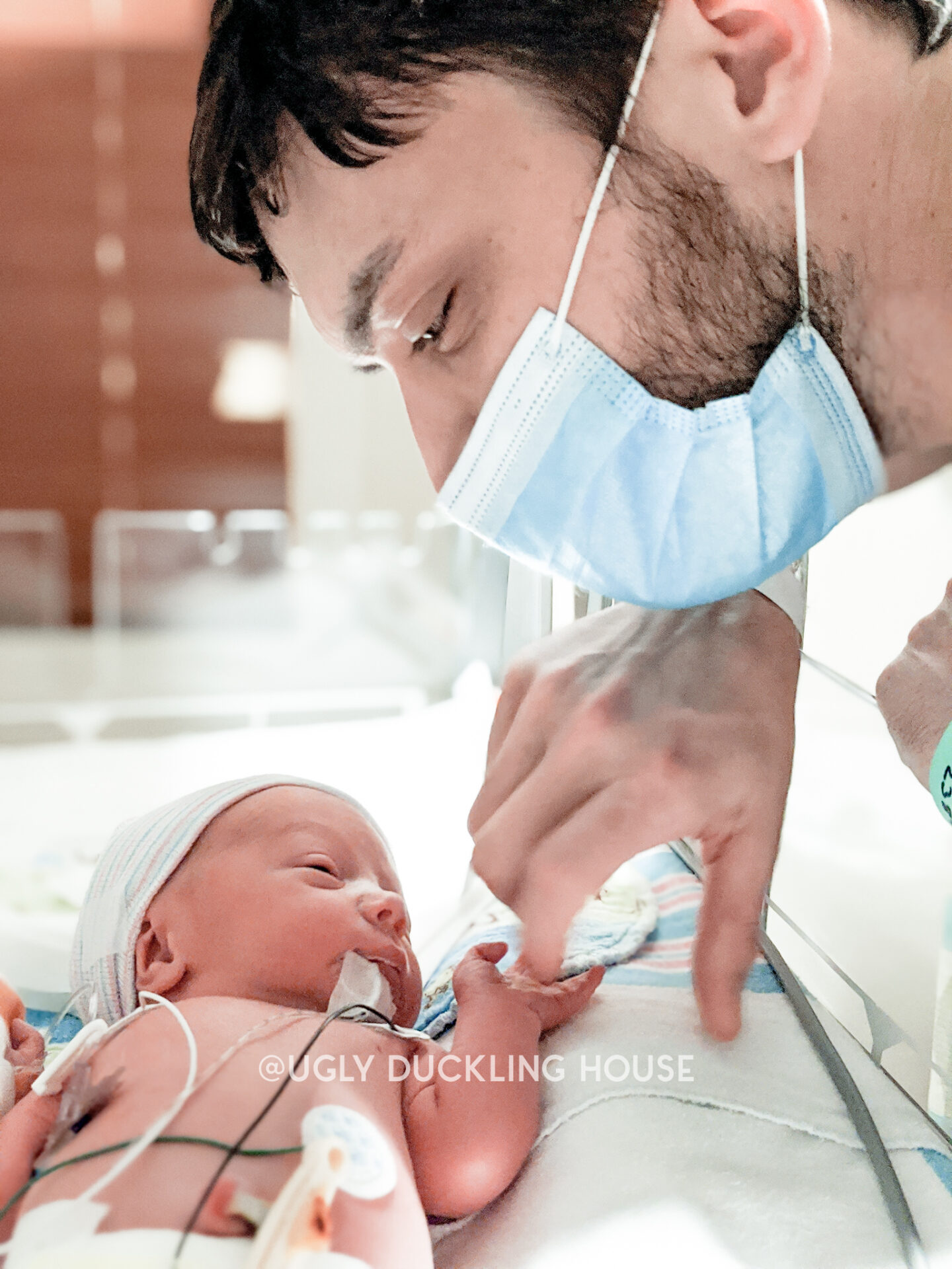 Ellis one day old - NICU - reaching out for Kyles hand