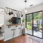 breakfast nook bar with butcher block counter and sliding glass door to patio