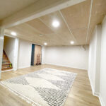 basement bedroom area with DIY drop down ceiling makeover and new flooring